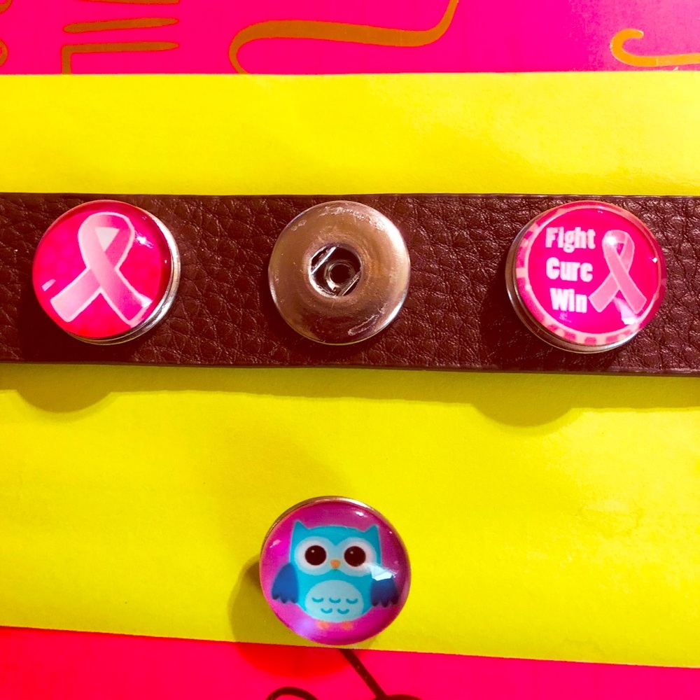 Leather bracelet with interchangeable buttons.
